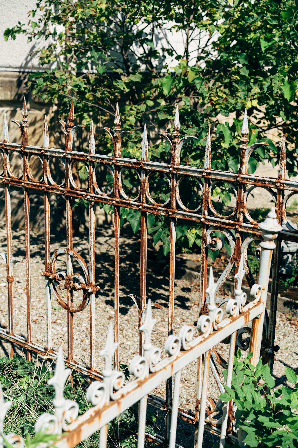 Modern ornate metal garden fence panel showing a durable alternative to composite fencing